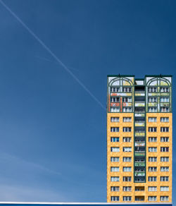 Low angle view of building against blue sky