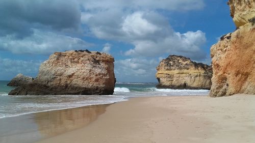 Scenic view of sea against cloudy sky