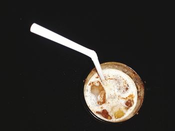 Close-up of coffee cup against black background