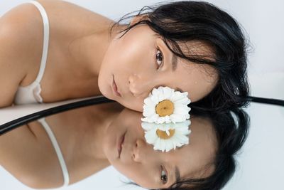 Fashion portrait of asian model with mirror