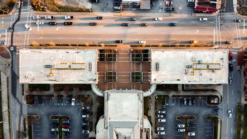 High angle view of cars on street against buildings in city