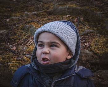 Portrait of young angry man standing outdoors