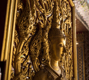 Close-up of buddha statue in temple