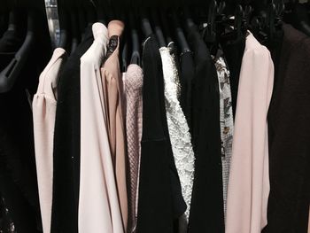 Close-up of clothes hanging in store