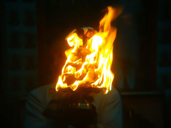 Close-up of fire burning at night