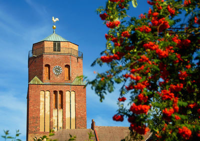 Close-up of clock tower against sky