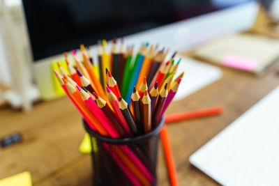 Close-up of multi colored pencils on table