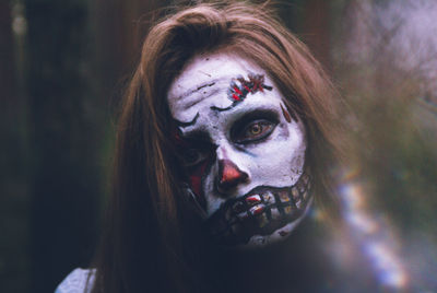 Close-up portrait of young woman with eyes closed