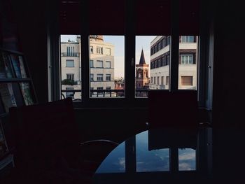 Reflection of buildings on glass window