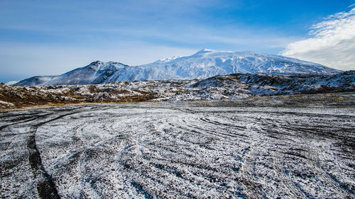 Scenic view of snowcapped mountains against sky