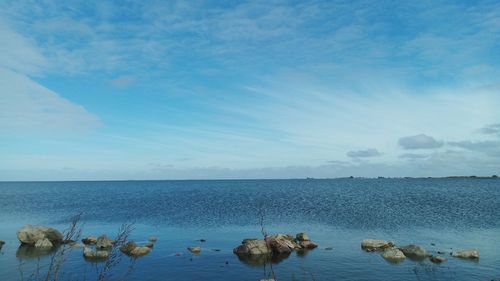 Scenic shot of calm sea against blue sky