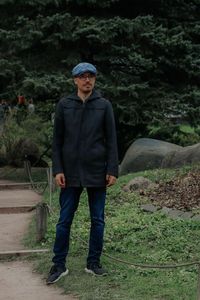 Portrait of man standing on rock