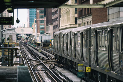 Train on railroad tracks in city