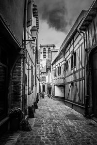 Street amidst buildings against sky