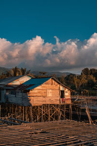 House on field against sky