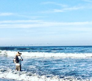 Full length of man on beach against sky