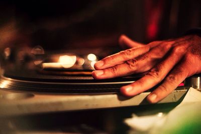 Close up of dj's hand spinning record