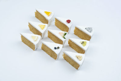 High angle view of cake against white background