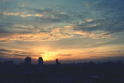 View of cityscape at sunset