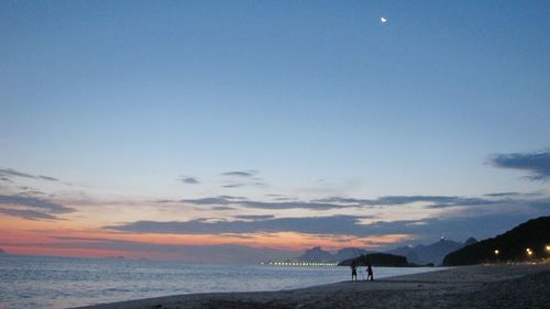 Scenic view of sea against sky at sunset