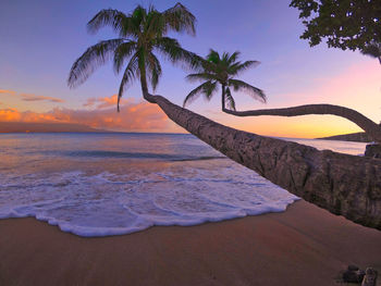 Scenic view of sea against sky at sunset