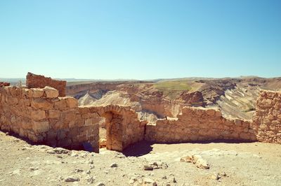 View of landscape against clear blue sky