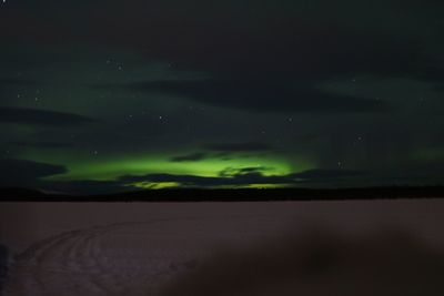Scenic view of landscape against sky at night