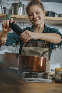 Woman holding coffee at cafe