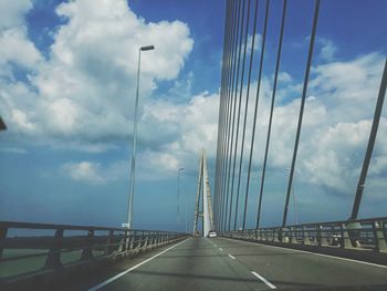 Bridge over road against sky