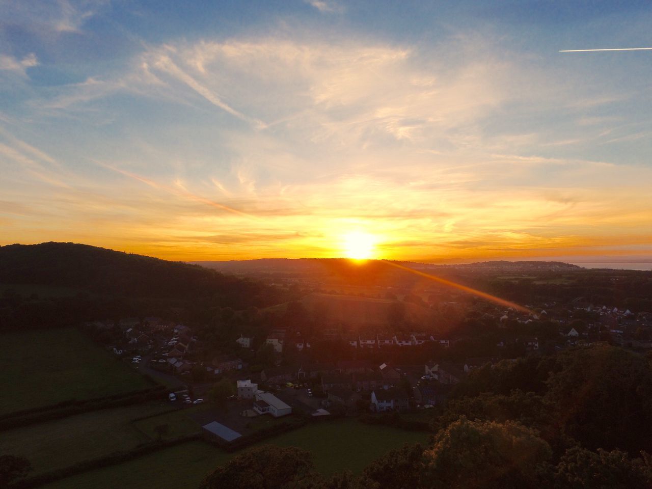 HIGH ANGLE VIEW OF RIVER AT SUNSET