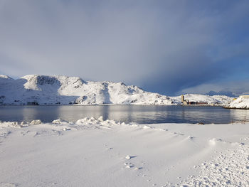 Scenic view of frozen lake against sky