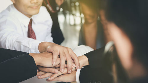 Close-up of couple holding hands