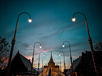 Low angle view of street light against cloudy sky