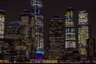 Low angle view of illuminated buildings at night