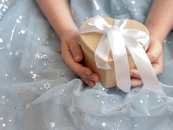 Midsection of woman holding gift box