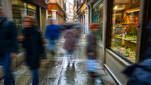 People walking on street in city