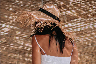 Rear view of woman wearing hat