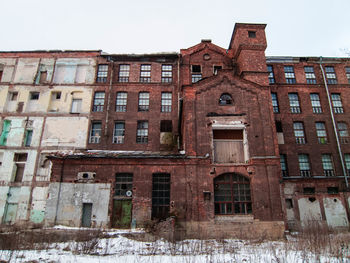 Low angle view of abandoned building against clear sky