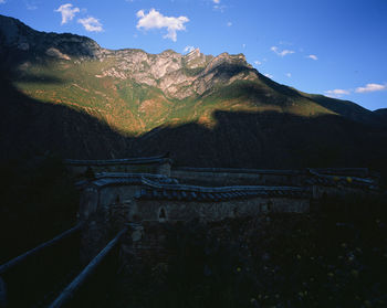 View of mountain range against cloudy sky