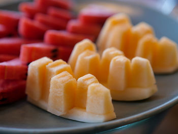 Close-up of chopped fruits in plate on table