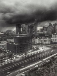 Cityscape against cloudy sky