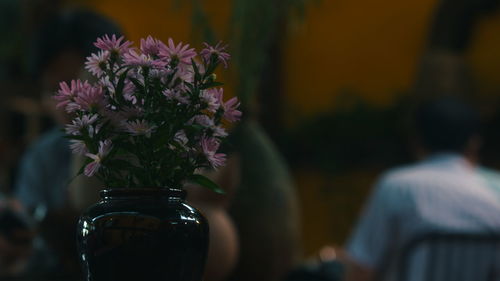 Close-up of flower vase on table