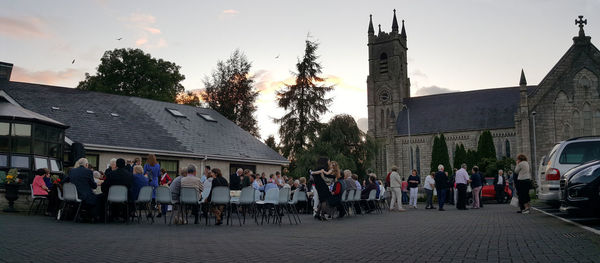 People at town square against sky