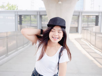 Portrait of happy asian young woman outdoors