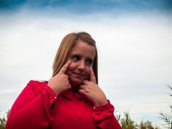 Woman standing against sky