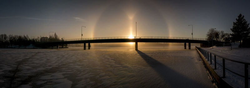 Scenic view of bridge against sky during winter