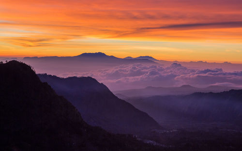 Scenic view of mountains against sky during sunset