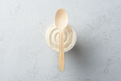 High angle view of bread on white table against wall