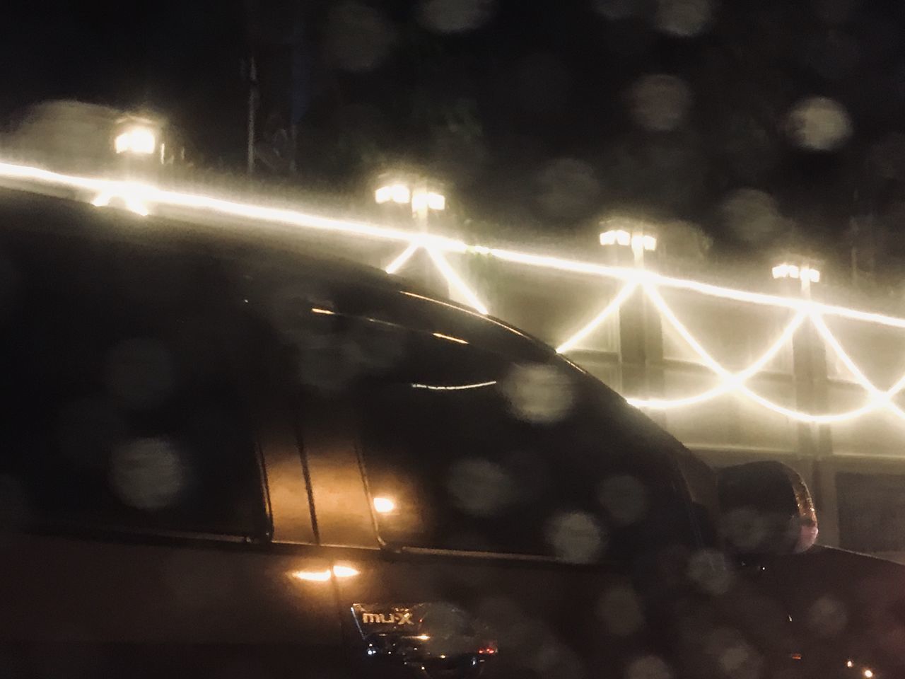 ILLUMINATED STREET LIGHT AT NIGHT