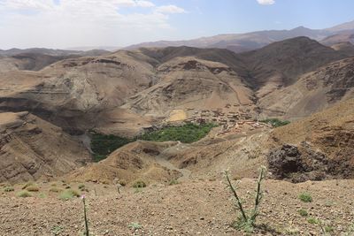 Scenic view of arid landscape against sky